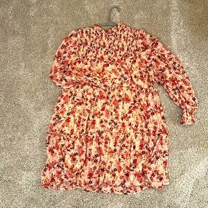 Cute soft pink floral dress with smocking by Entro